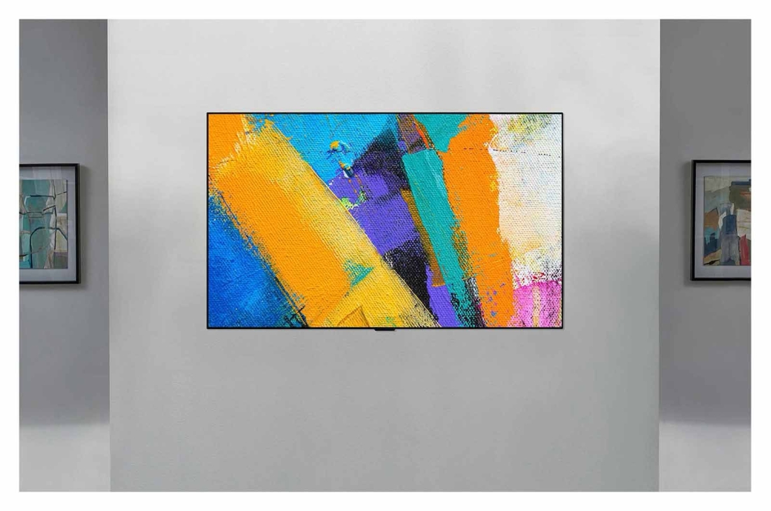 LG Smart OLED GX | GX 65'' | 4K | ThinQ AI | a9 Gen4 , Sanʼat asari singari devordan nafosat bilan chiqib turgan LG Gallery Design televizorining old tomondan koʻrinishi, OLED65GXRLA, thumbnail 12