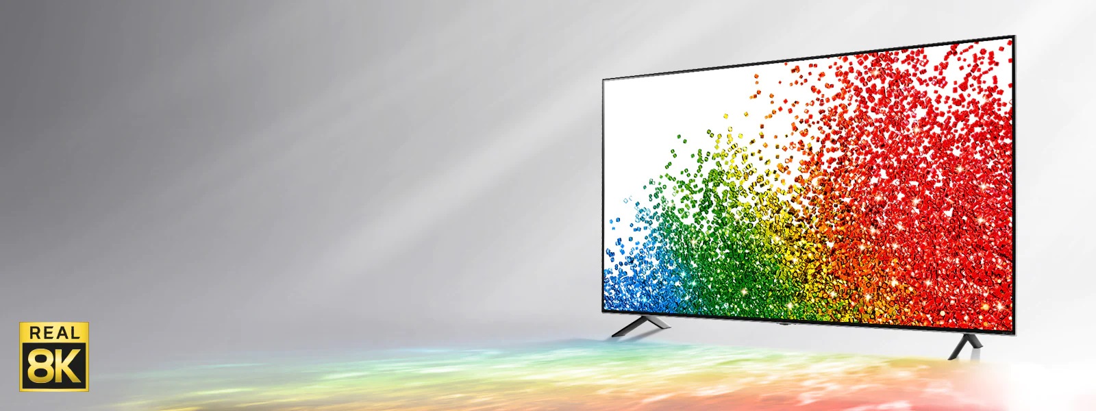 Изображение телевизора LG NanoCell на сером фоне с отражаемыми от пола разными цветами, показанными на экране.