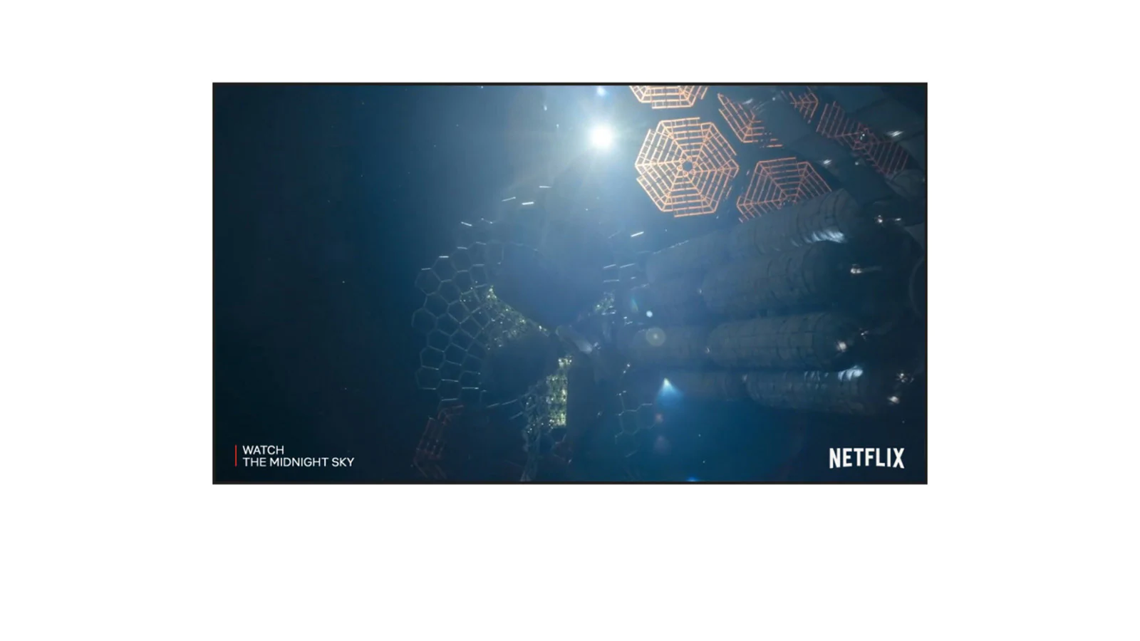 TV screen showing the trailer for The Midnight Sky on Netflix (watching video).