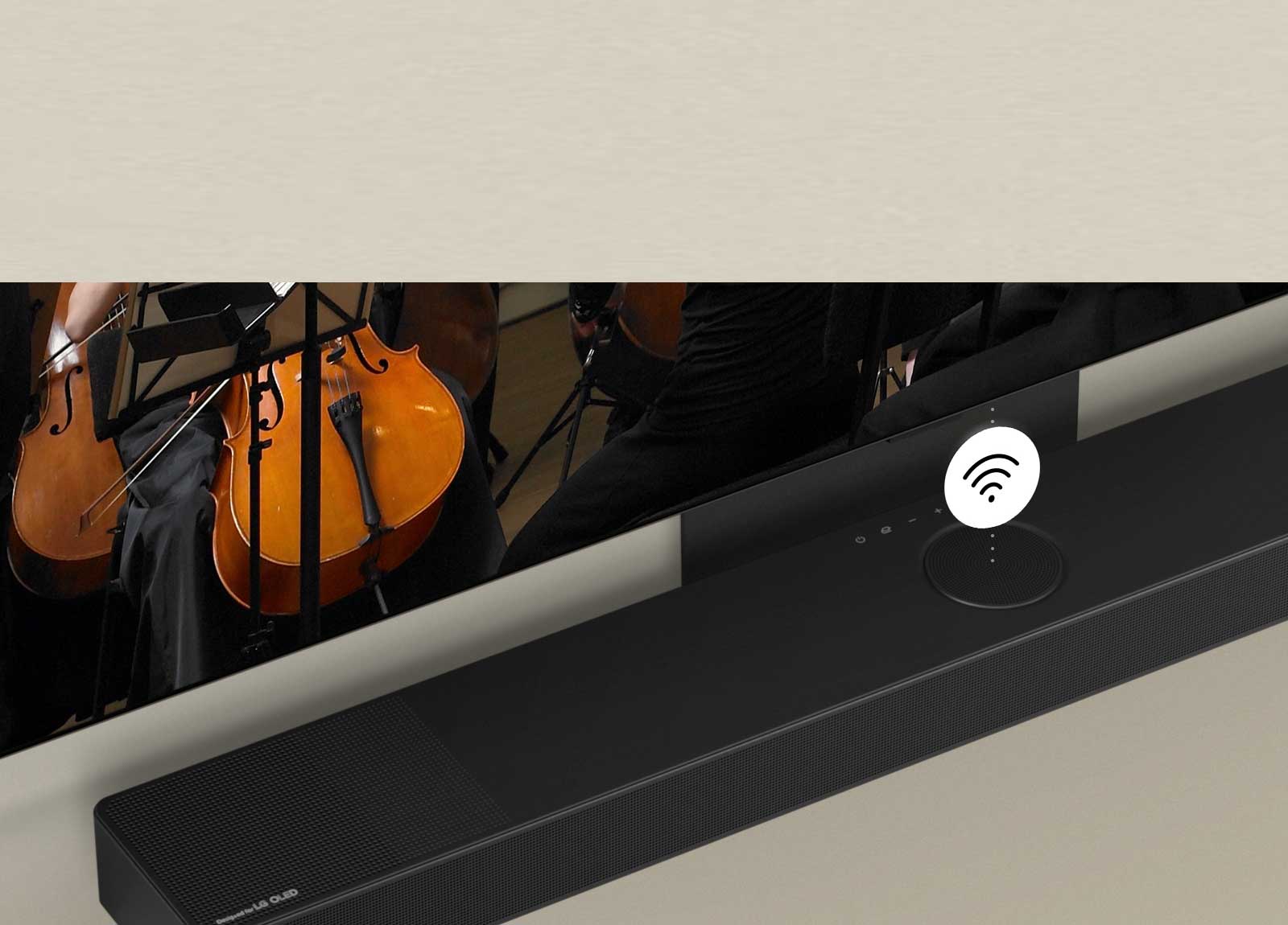 Телевизор LG OLED TV и звуковая панель LG Soundbar закреплены на стене с белым графическим символом Wi-Fi посередине.