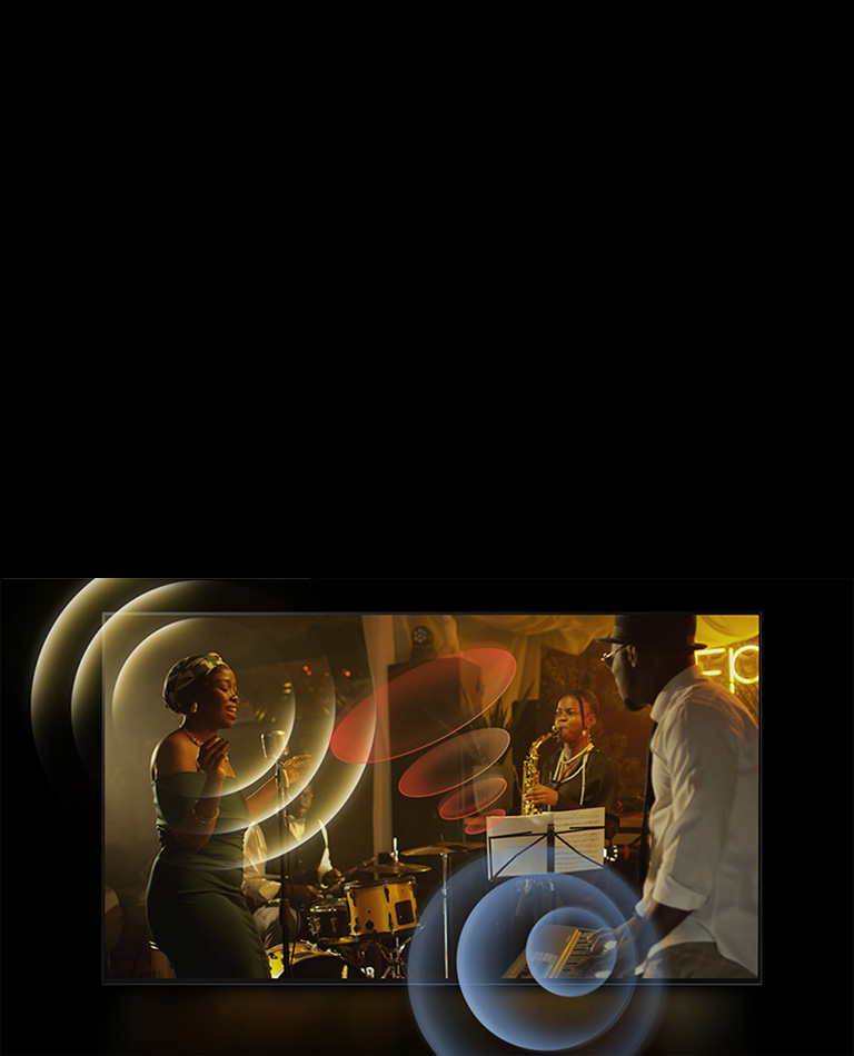 На экране телевизора LG OLED демонстрируется выступление музыкантов с яркой круговой графикой вокруг микрофонов и инструментов.