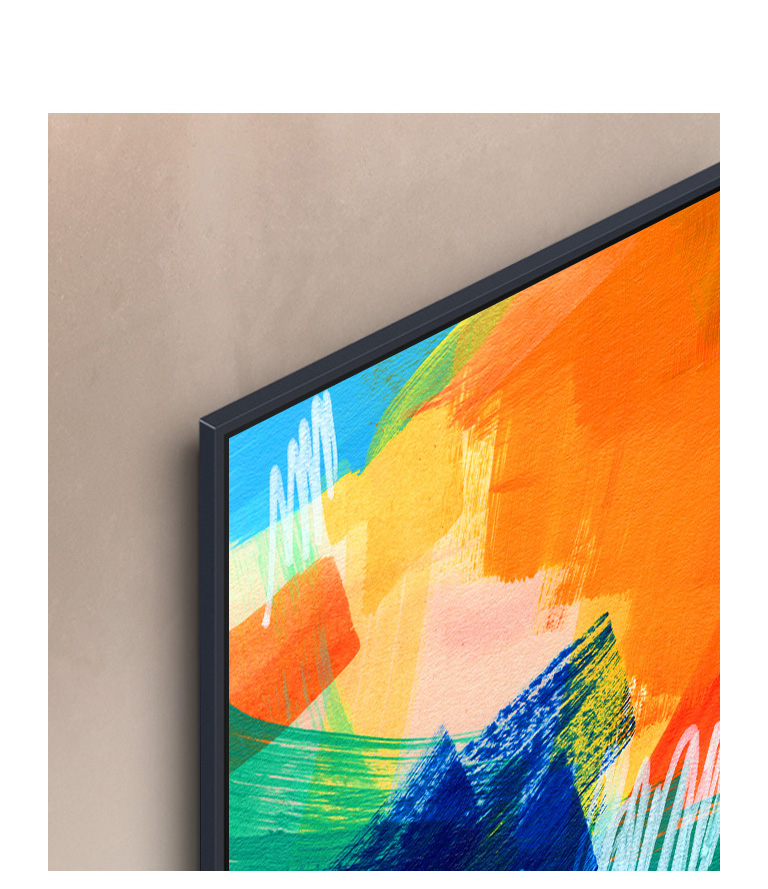 Левый верхний угол телевизора LG, на экране которого изображена разноцветная художественная композиция. Телевизор закреплен на стене с едва заметным зазором.