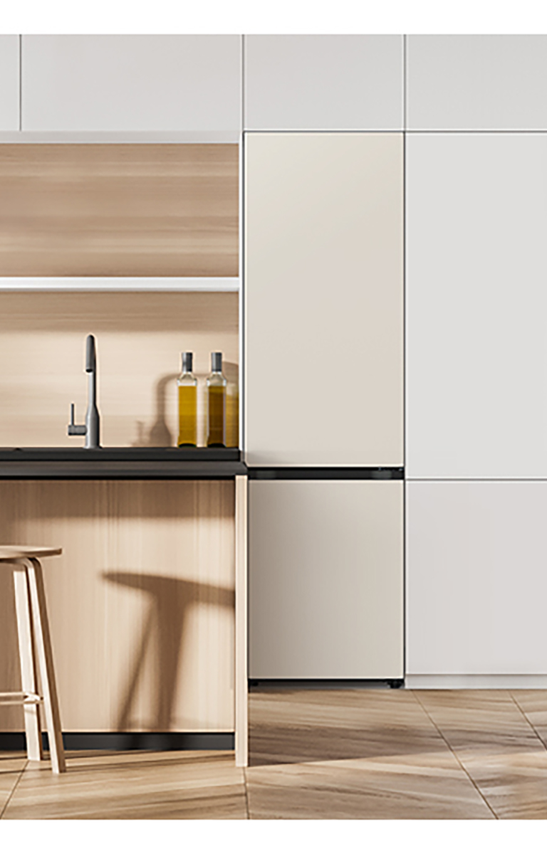 It shows mist beige color Bottom Freezer placed in the kitchen that matches naturally to the furniture around.