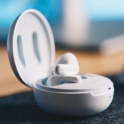 TONE FRee White's cradle is open and only the right earbud is out