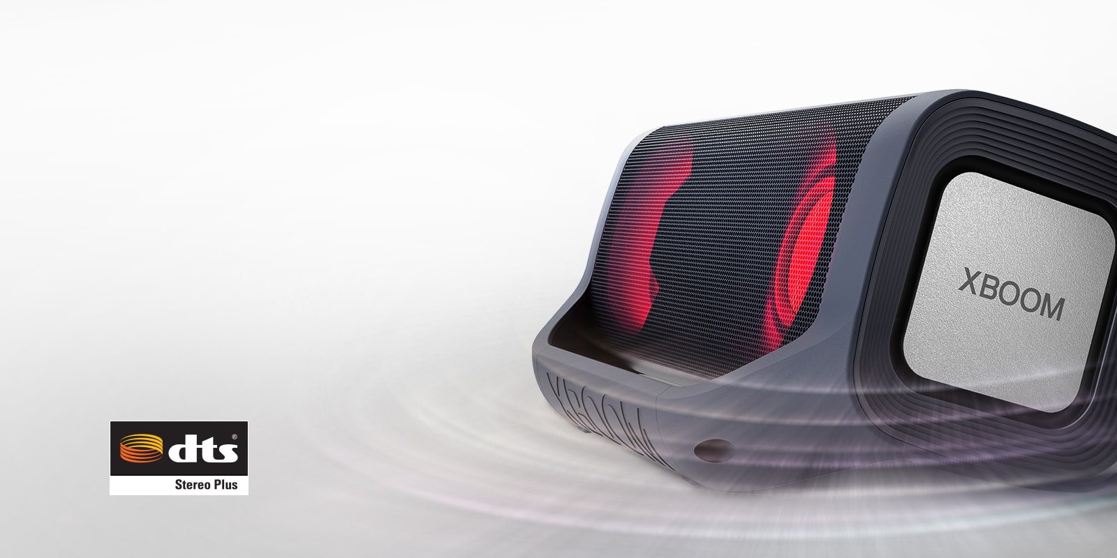 Mid-shot of the left side of an LG XBOOM Go on a white surface. It has red lighting and a ripple wave effect around it.