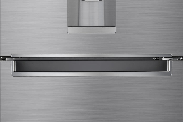 A close up photo of the center of the refrigerator showcasing the elegant and minimalistic handle.