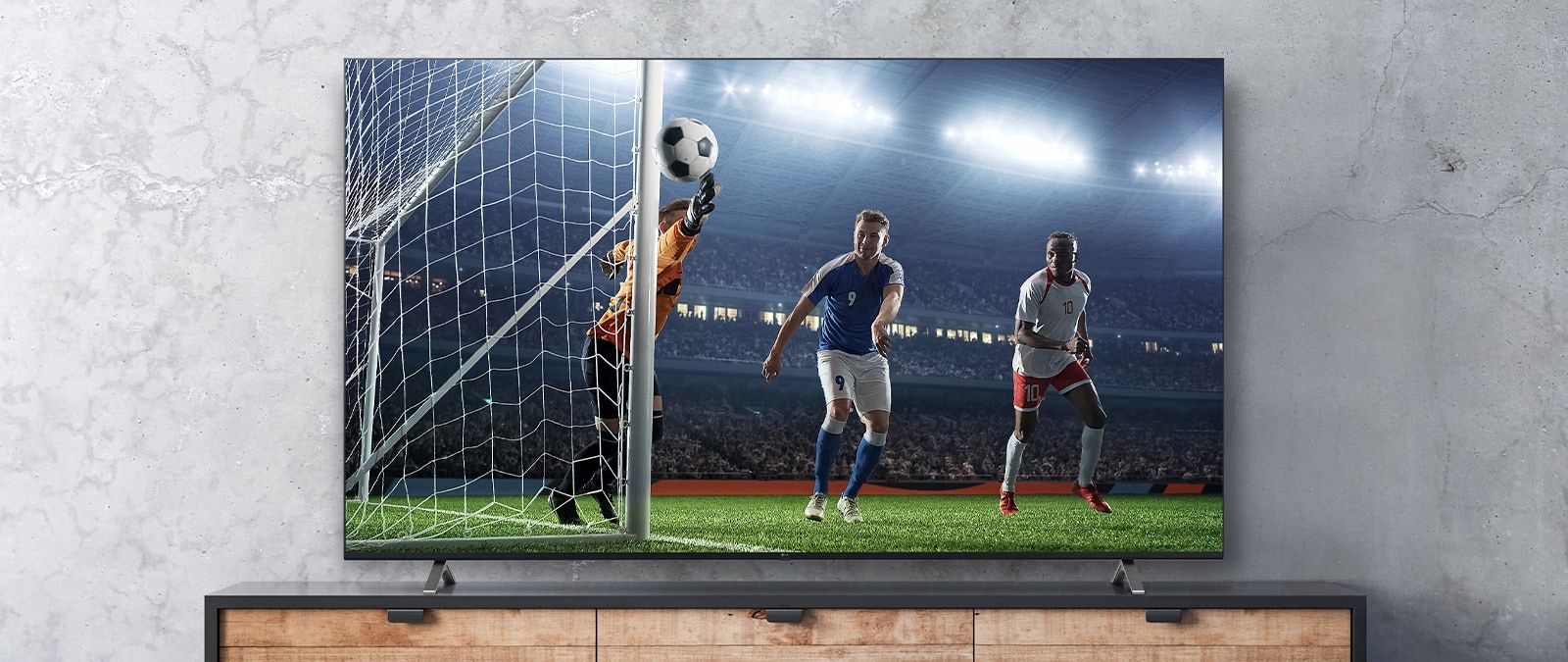 The soccer game scene shown on the TV screen appears real.