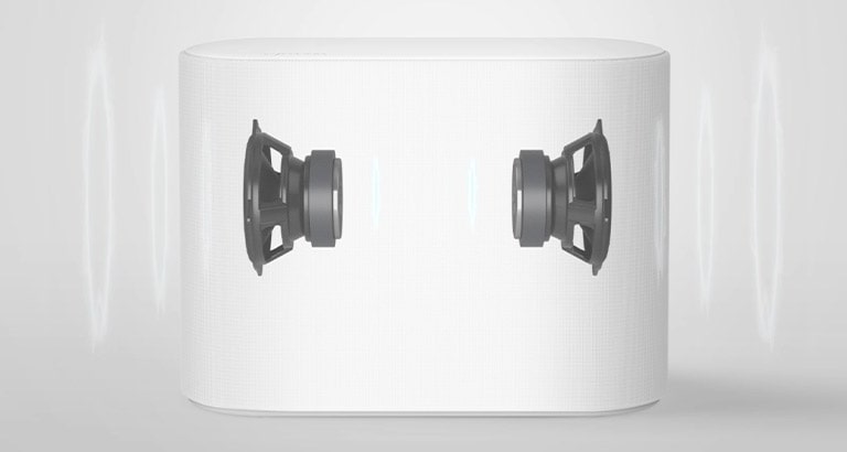 A subwoofer is placed on a white floor. Two components inside the subwoofer are shown.