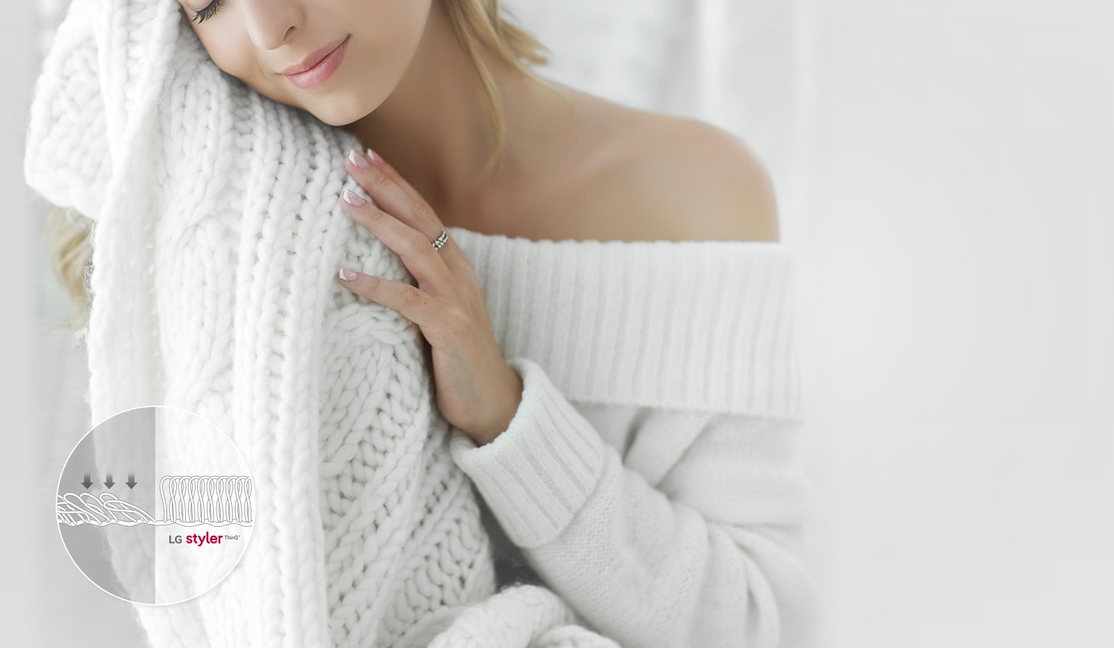 It shows a woman wearing a thick knit is feeling the softness of the knit.