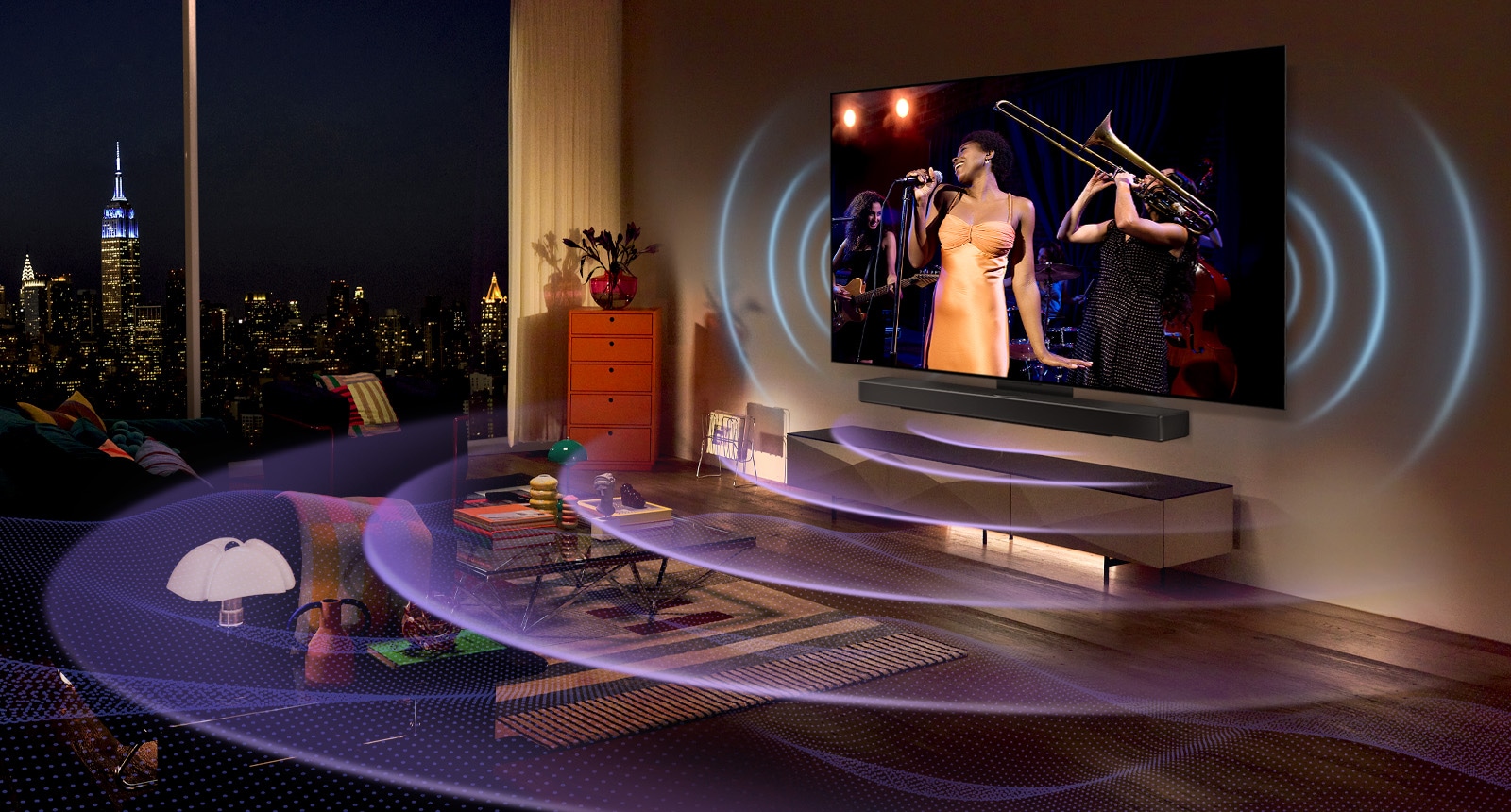 An image of an LG OLED TV in a room showing a music concert. Blue curved lines depicting TV sound and purple curved lines expressing Soundbar sound fill the space.