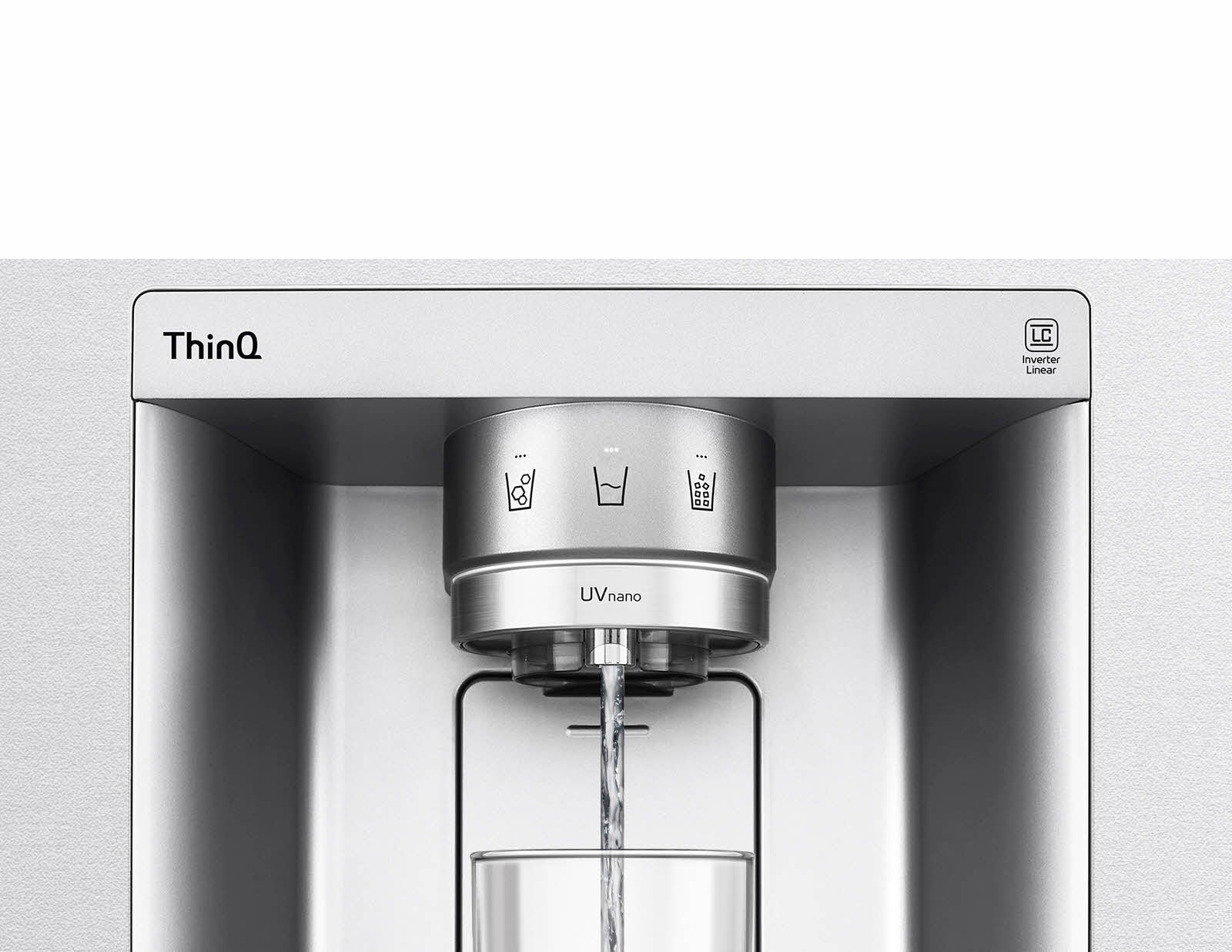 A video starts zoomed in on the water dispenser. The exterior of the refrigerator goes clear and now the interior of the door and mechanical parts of the dispenser nozzle can be seen. The video zooms in further to show the water droplets as they fall through the UVnano part of the nozzle which reduces the bacteria. The view zooms back out to see the exterior of the refrigerator again as water is being dispensed into a glass.