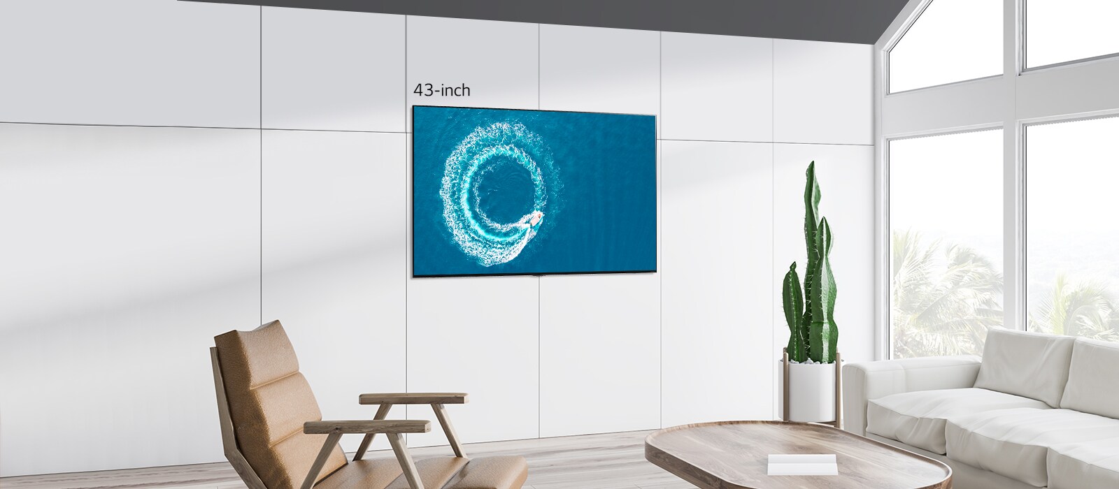 LG QNED MiniLED TV wall mounted in a modern, white space. Scrolling left-right shows the difference in size between a 43-inch and 86-inch screen.
