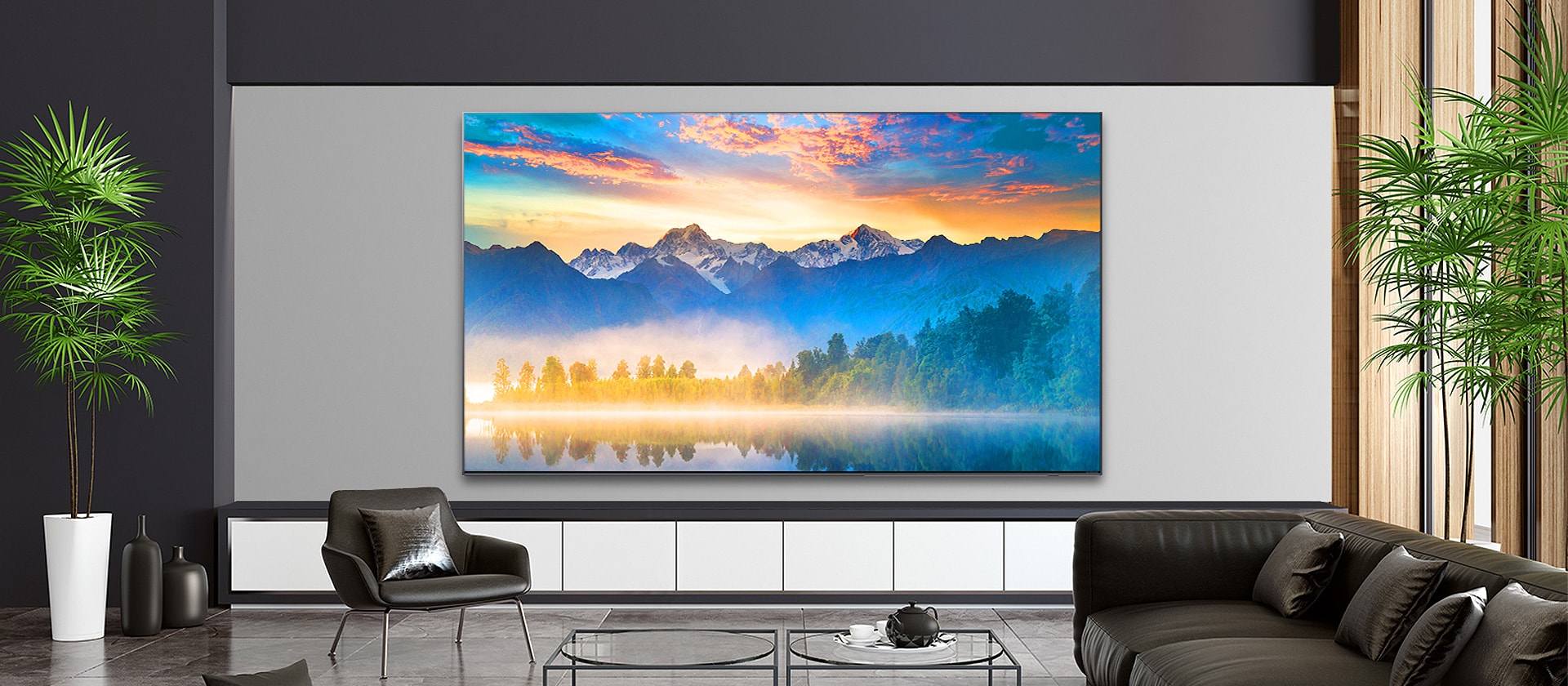 A living room with a wall-mounted TV screen showing a natural scene.