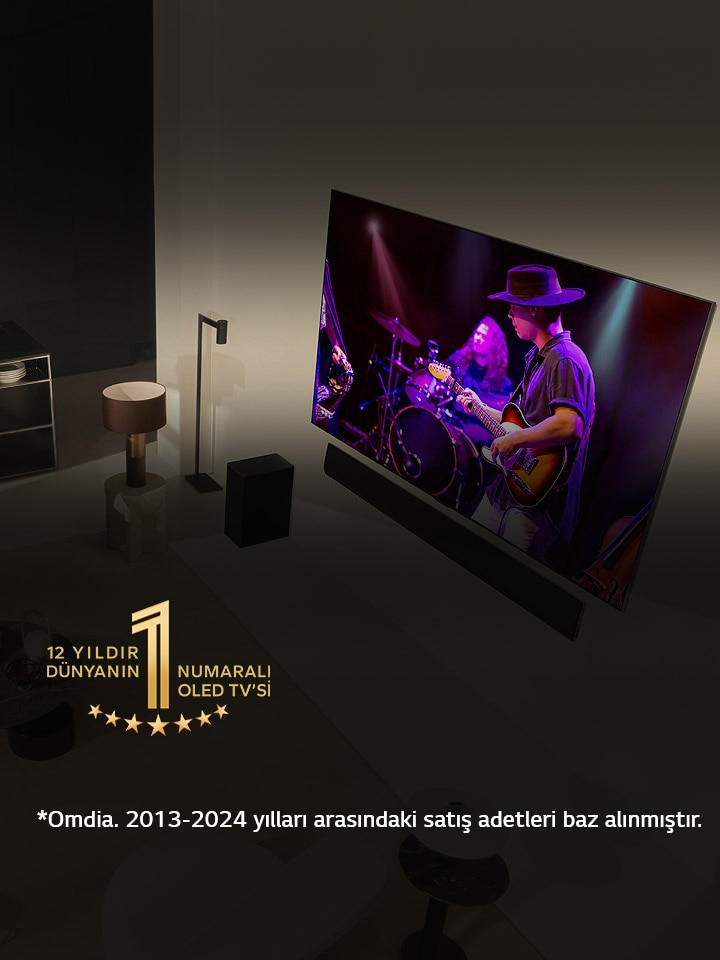 Modern bir dairede geniş ekran OLED TV’de konser seyreden bir adam ile kadının tepeden görünümü. Görüntüde “11 Yıldır Dünyanın 1 Numaralı OLED TV’si” amblemi yer alıyor. Bir sorumluluk reddi ekranda görünür: “Kaynak: Omdia. Birim sevkiyatları, 2013 - 2023. Sonuçlar, LG Electronics tarafından onaylandığı anlamına gelmemektedir. Sonuçlara güvenilmesi üçüncü tarafın kendi sorumluluğundadır. Daha fazla detay için https://www.omdia.com/ adresini ziyaret edin.”