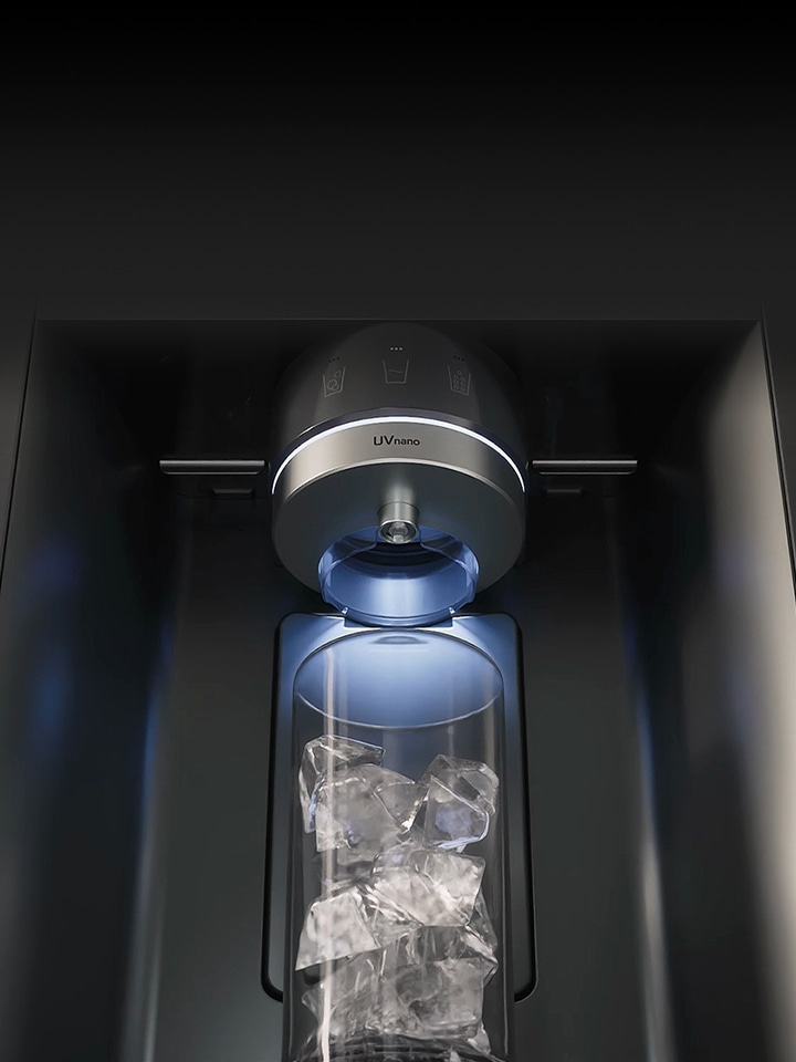 Close-up of LG fridge freezer dispenser filling a glass with cube ice