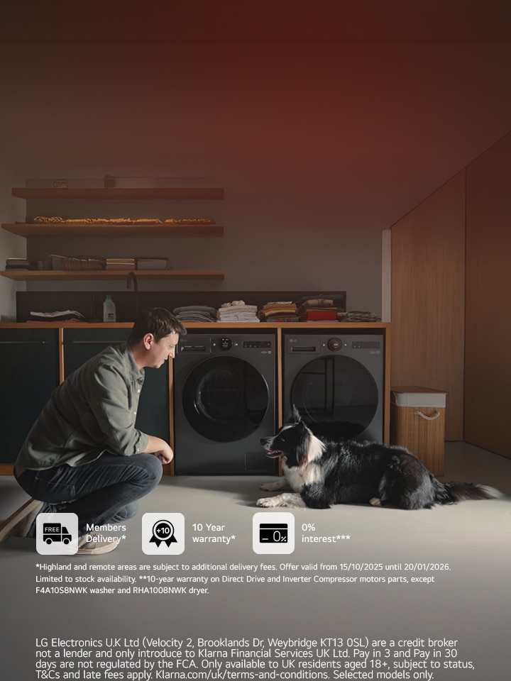 A man and his dog are in front of an LG washing machine and dryer