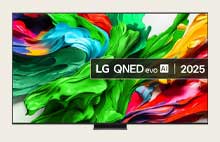 A girl and a dog are seated in front of a LG QNED TV mounted on a wall depicting three elephants walking outwards above a LG Soundbar.