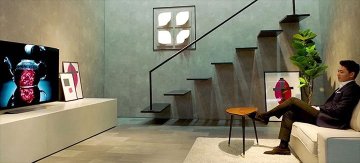 An image showing lg's new artificial intelligent interactive oled tv w8 at ces 2018 las vegas.