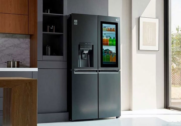 The LG Instaview Door-In-Door refrigerator with its contents visible through the mirrored glass panel.