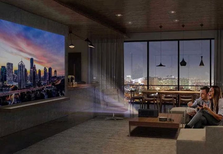 Watching a movie on an LG projector in the home cinema room.