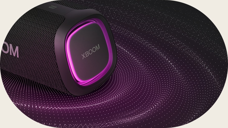 Close-up view of the right side with pink lighting on. Sound graphics are under the speaker.