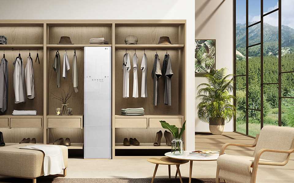 A living space with the LG Styler placed as part of the wardrobe