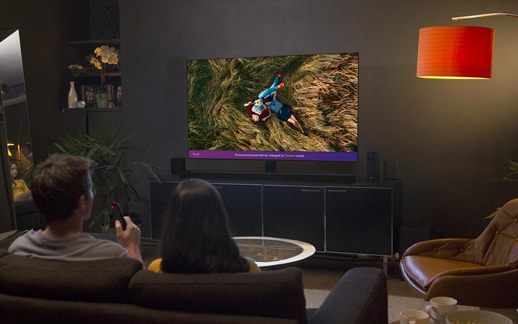 An image of a couple watching Rakuten TV movies with the lg tv.