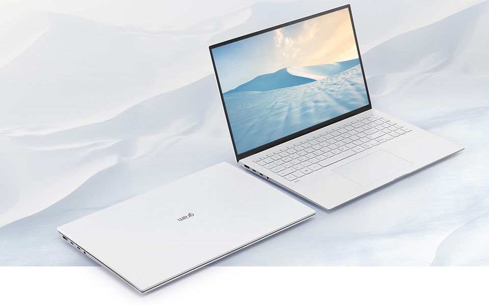 An open laptop lays next to a closed copy of the laptop