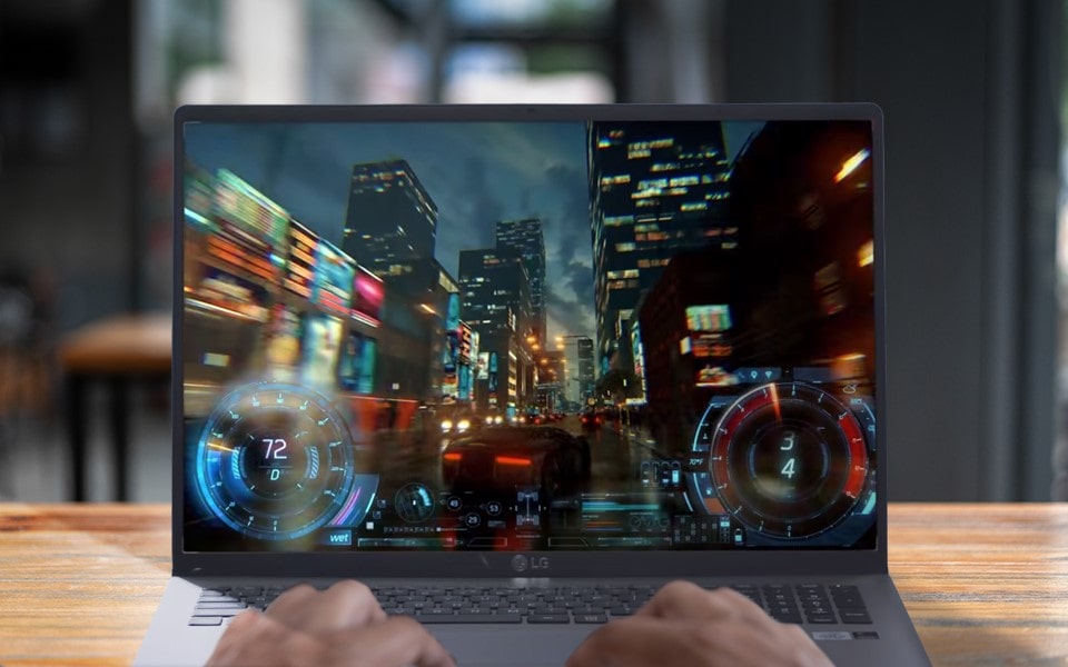 An action movie scene is shown on a laptop 