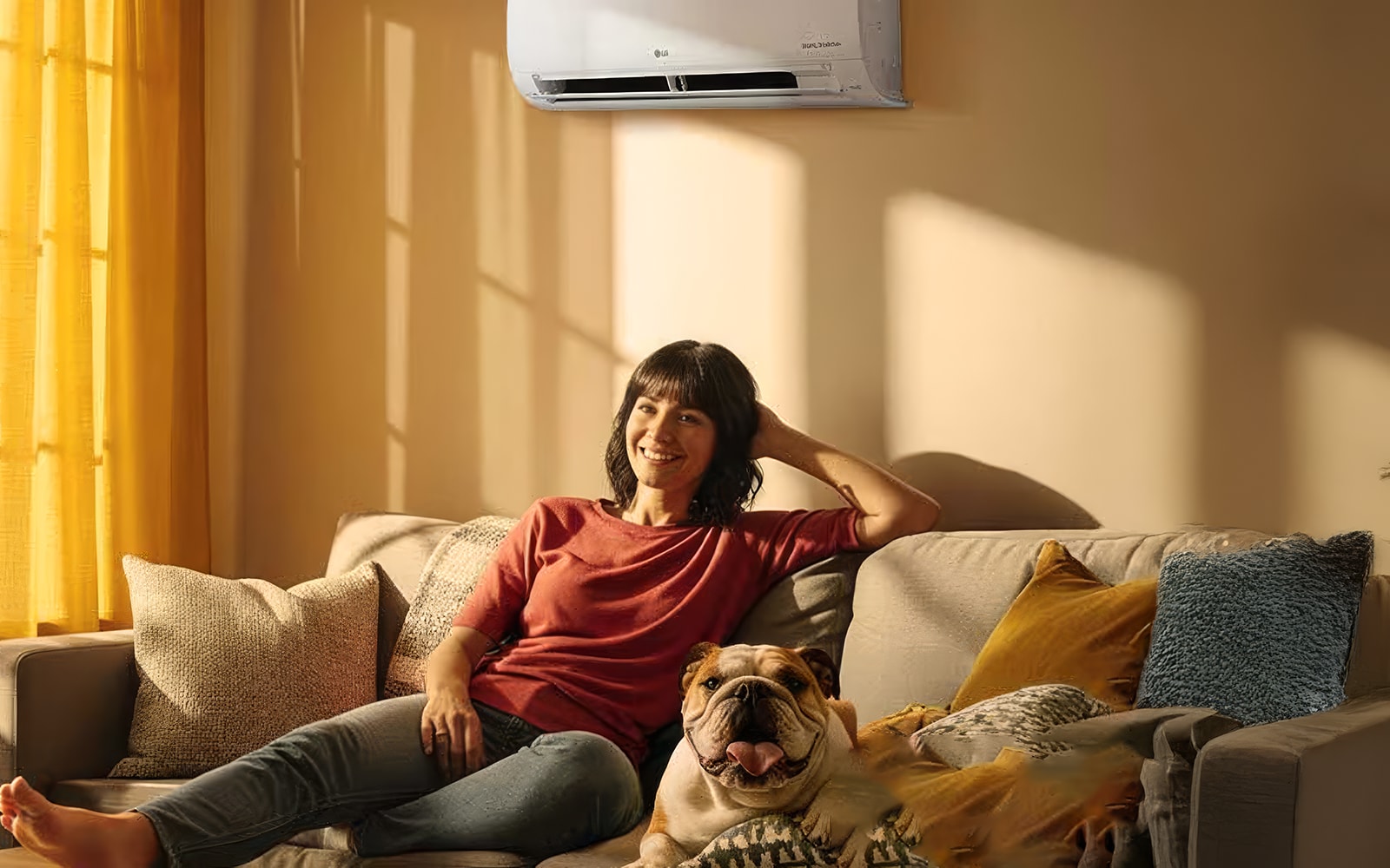A woman sitting on a living room sofa with the LG HVAC heating and cooling system turned on.