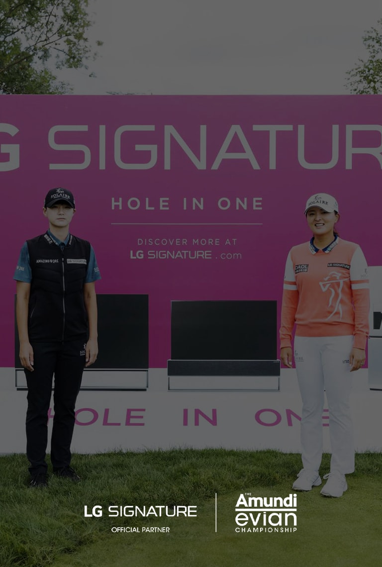 A pink LG SIGNATURE ad on a golf course, featuring product images with two people standing in the foreground against a verdant landscape.