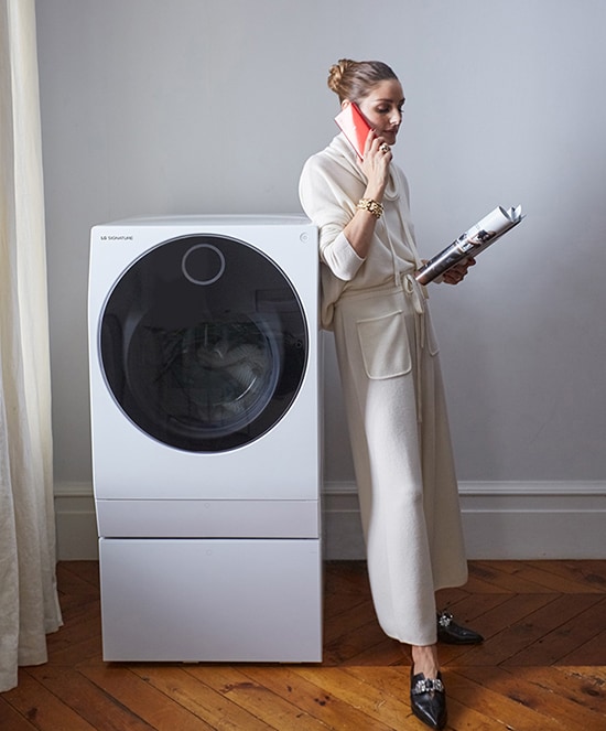 As Olivia Palermo waits for her LG SIGNATURE Washing Machine to finish washing her clothes, she occuppies herself with other daily tasks.
