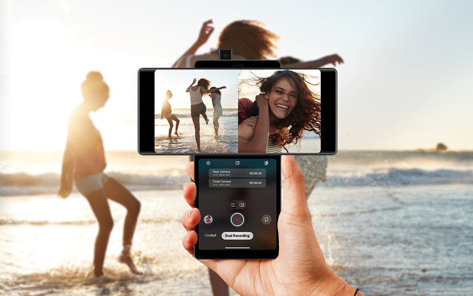 A screenshot of the dual recording camera feature capturing a moment at the beach